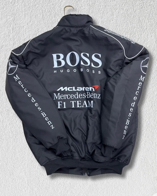 Back view of McLaren Racing Puffer Jacket with bold Hugo Boss, McLaren, and Mercedes-Benz F1 Team branding, ideal for motorsport streetwear fans.