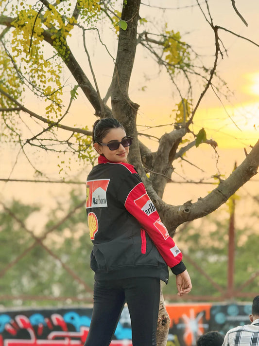 Back view of Marlboro Racing Puffer Jacket – Motorsport Luxury Edition featuring iconic Marlboro and Shell logos, worn in a sunset outdoor setting.