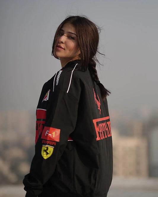 Back view of Ferrari Scuderia Jacket – Black Cotton Racing Unisex featuring bold Ferrari and F1 patches, ideal for motorsport enthusiasts.