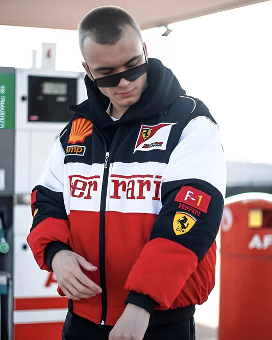 Rare Collector's Edition Vintage Ferrari Racing Embroidered Puffer Jacket styled at gas station, featuring bold Ferrari branding and racing patches.