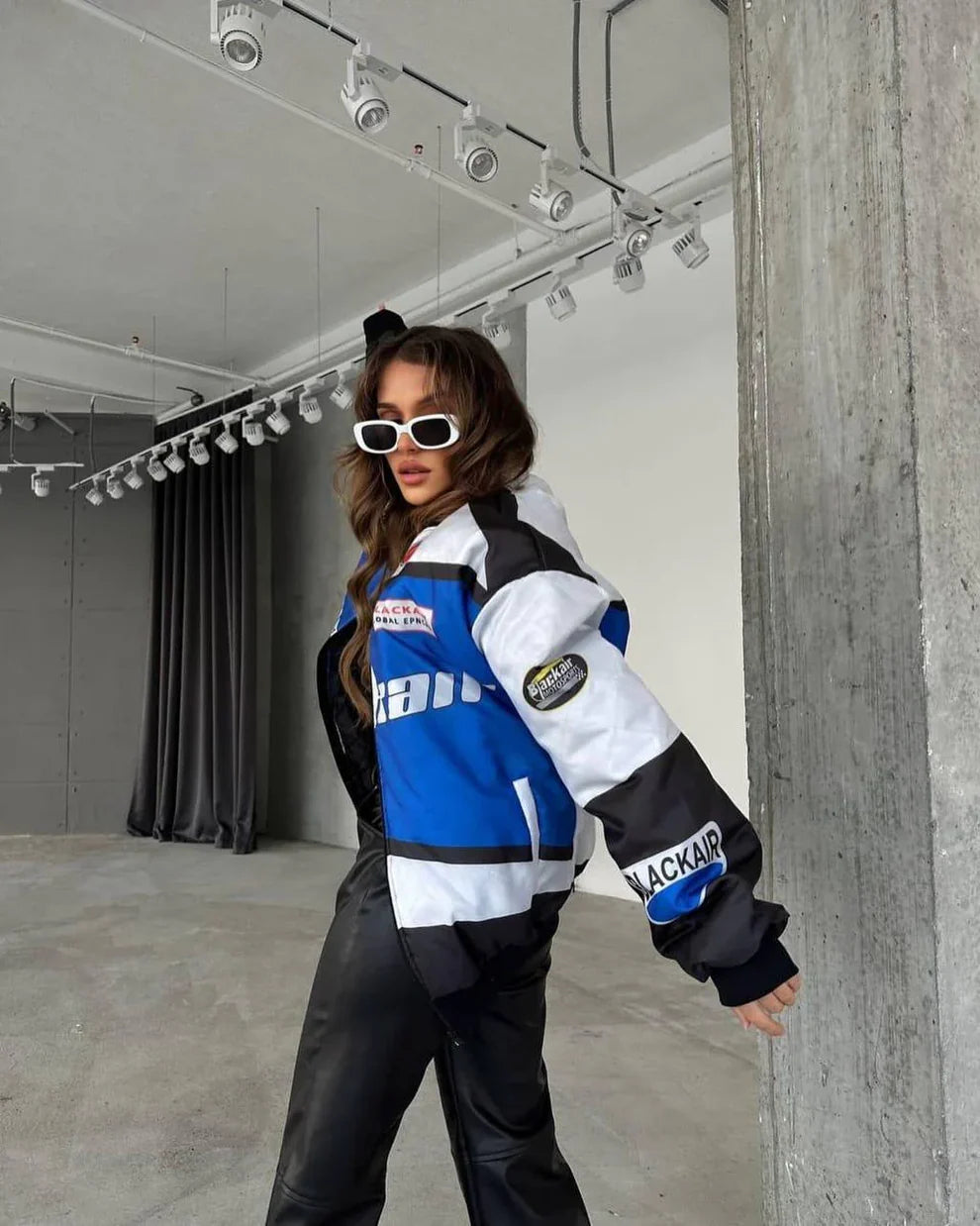 Side angle of BlackAir Motorsport Jacket – NASCAR Printed Streetwear Drop showing sleeve branding and bold streetwear silhouette.