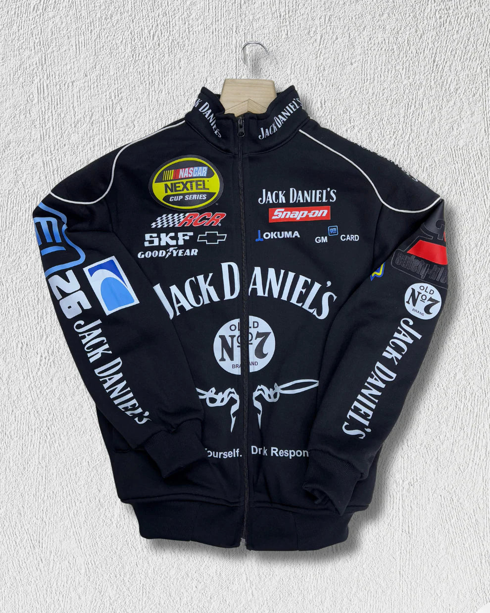 Front view of Jack Daniel’s Printed Puffer Jacket – Unisex Streetwear featuring Old No. 7 branding and colorful sponsor-style logos.