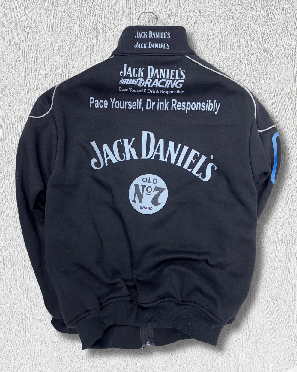 Full back view of Jack Daniel’s Printed Puffer Jacket – Unisex Streetwear highlighting bold branding and racing-inspired design elements.