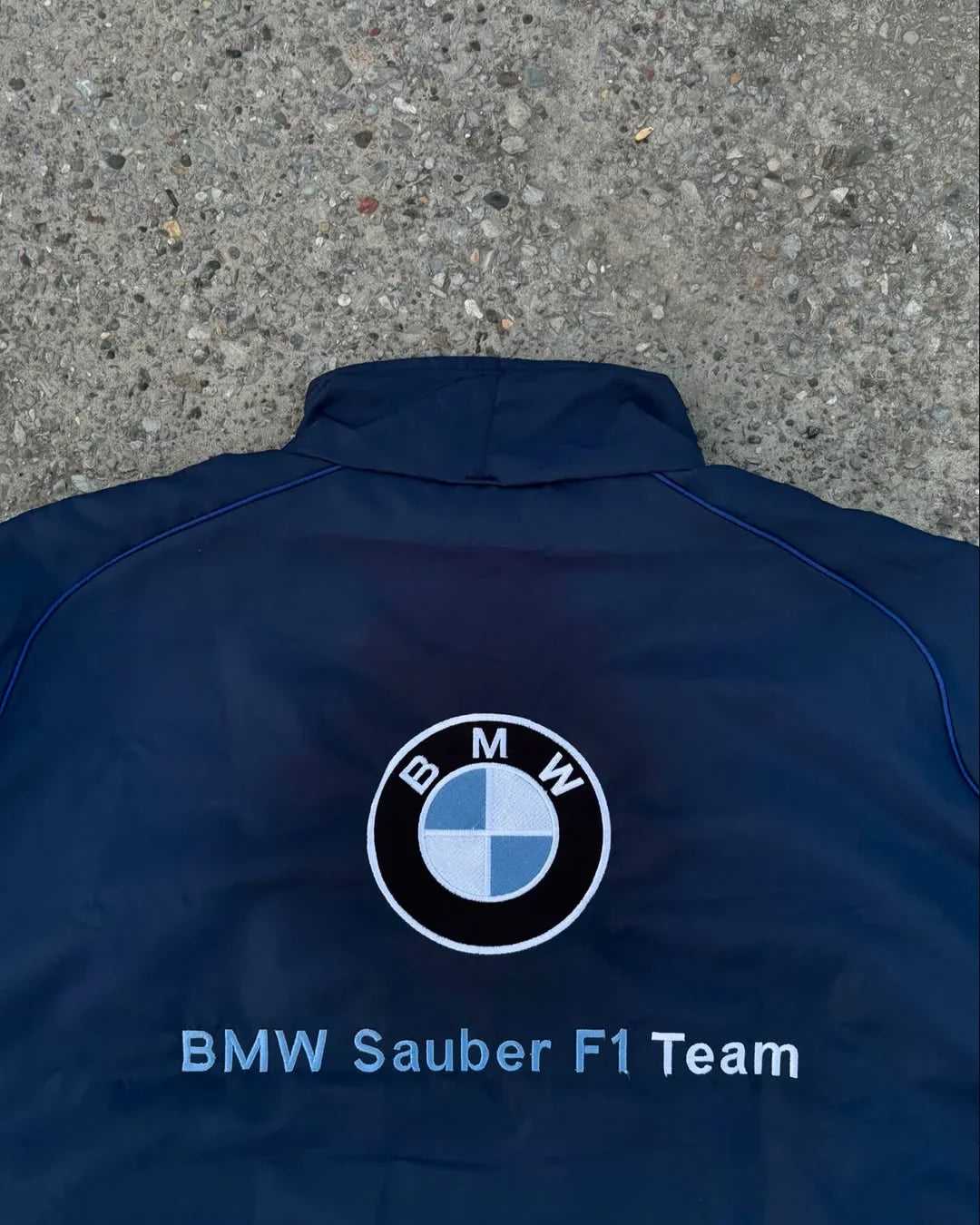 Back view of BMW Petronas F1 Racing Jacket featuring large BMW logo and BMW Sauber F1 Team text for authentic motorsport appeal.