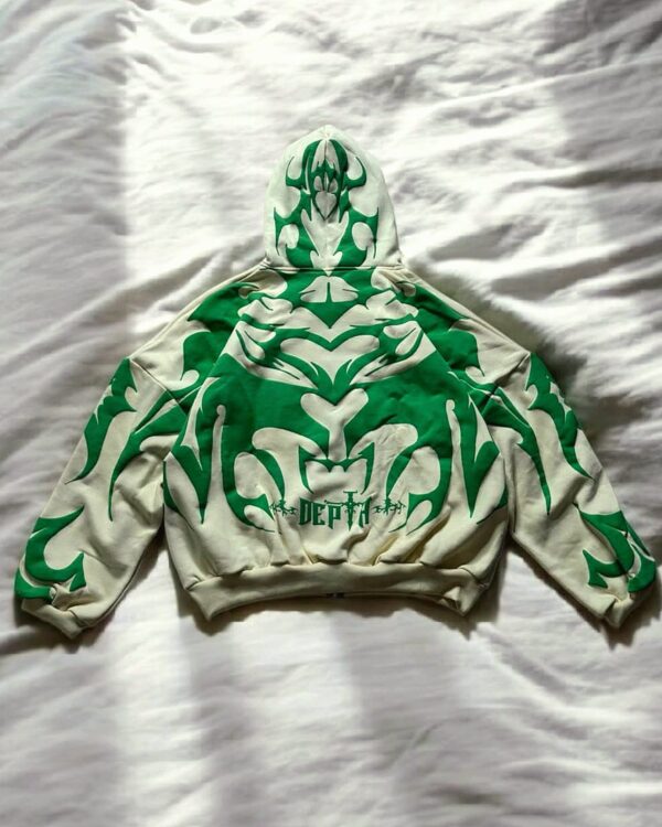 Back view of oversized cream white hoodie featuring large green tribal shadow design and 'DEPTH' text, ideal for Indian streetwear fashion.