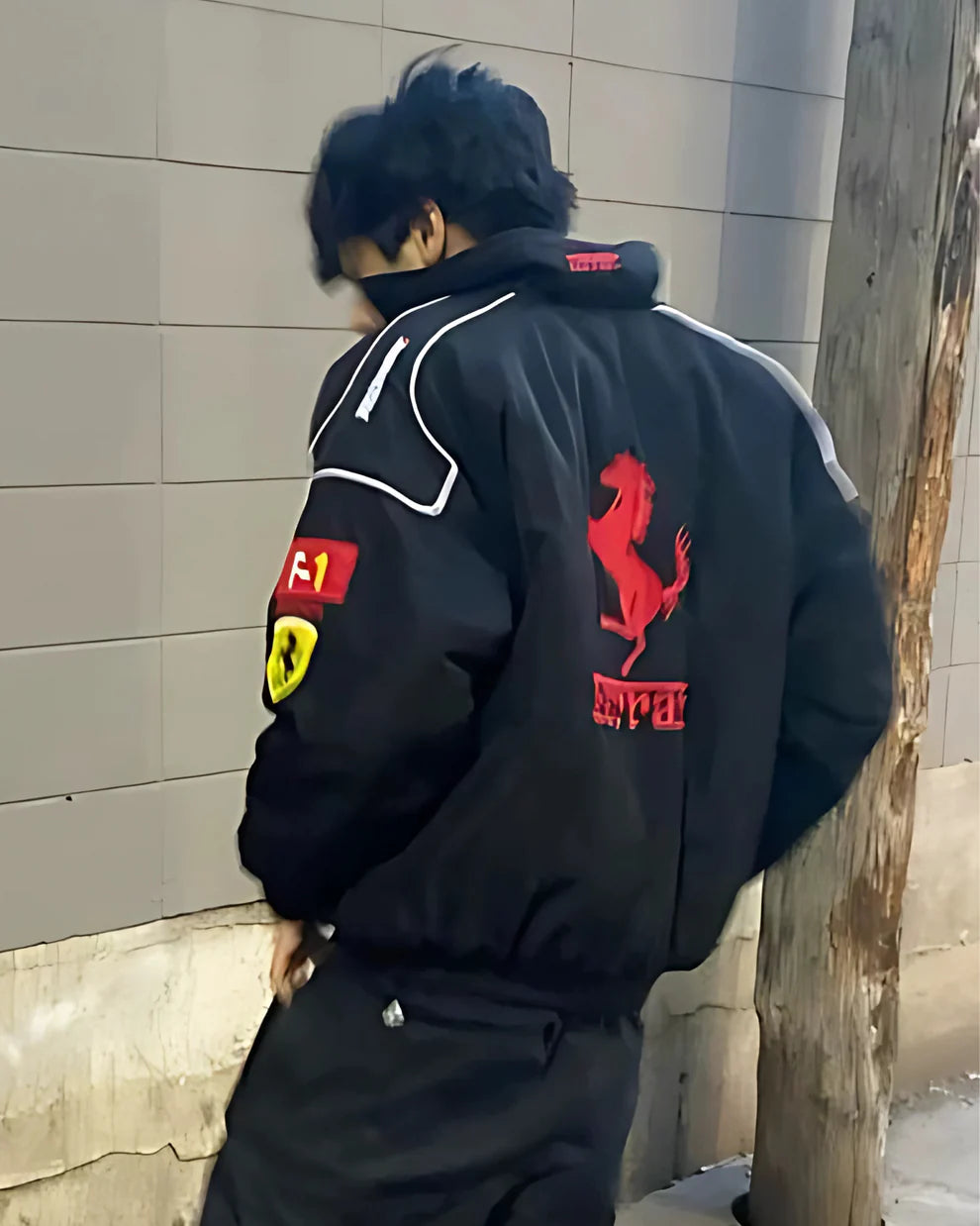 Back view of the Premium Ferrari Racing Jacket – F1 Streetwear Edition featuring the iconic prancing horse logo and red Ferrari branding.