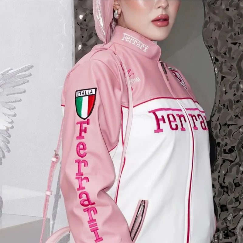 Close-up of Ferrari Pink Vintage Vegan Leather Jacket showing Italia patch and Ferrari branding. Eco-friendly motorsport-inspired fashion.