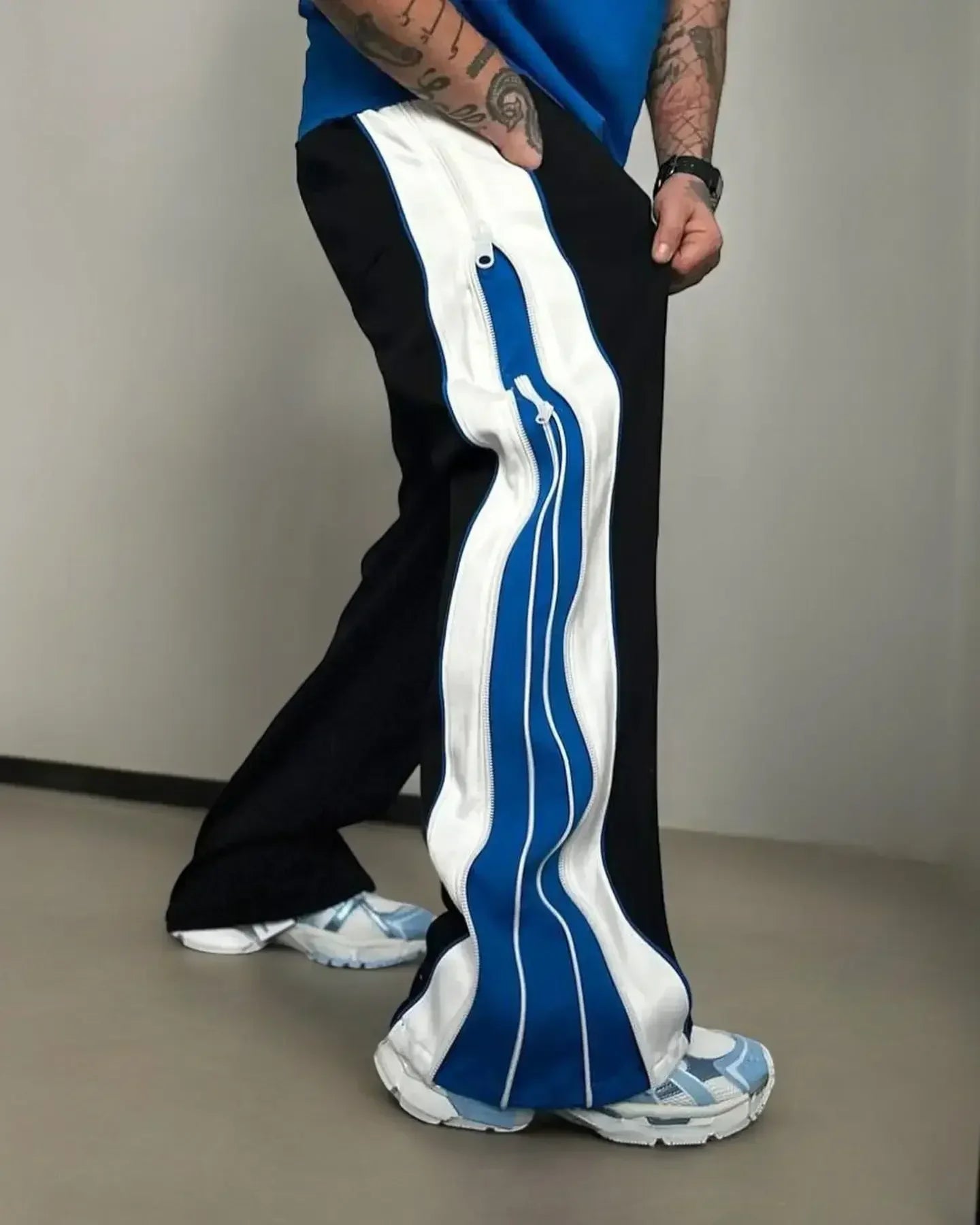 Stylish Blue 3-Way Zip Baggy Pants with bold side zippers and colorblock design, perfect for versatile streetwear and comfortable daily wear.